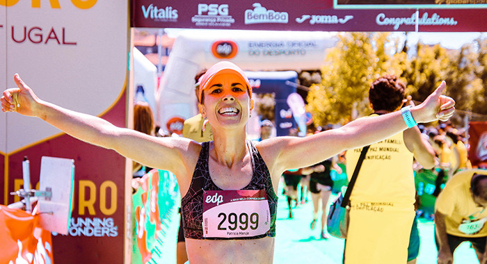 Athlete cheers at the finish line