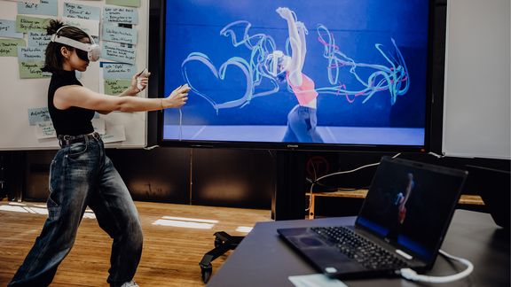 Dancer wearing VR glasses
